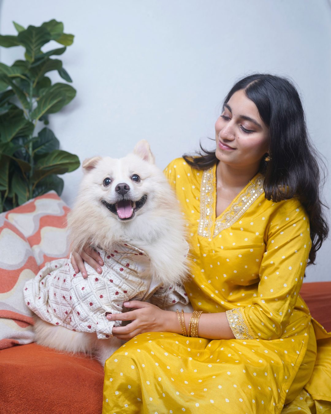 Owner and dog in matching festive wear, the dog in the Careatic Laal Bindi kurta